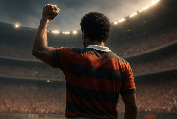 Calciatore visto di spalle mentre alza il pugno chiuso in uno stadio gremito, gesto simbolico di protesta e libertà, in stile iperrealistico.