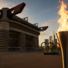 “Stadio San Siro al tramonto con fiaccola olimpica e anelli dei Giochi, simbolo delle sfide dei Milano impianti sportivi verso le Olimpiadi 2026