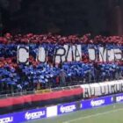 Curva del Potenza gremita di tifosi con coreografia rosso e blu e striscione “CURVA OVEST” esposto sugli spalti durante la partita Ternana Potenza Coppa Italia.