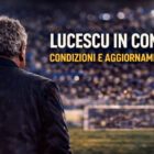 Allenatore di calcio di spalle in uno stadio illuminato con la scritta Lucescu in coma: condizioni e aggiornamenti.