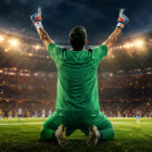 Dibu Martinez di spalle esulta in uno stadio illuminato dopo una parata decisiva, immagine sportiva iperrealistica ispirata alla carriera del portiere argentino.
