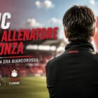 Juric nuovo allenatore del Monza: grafica editoriale con il tecnico raffigurato di spalle a bordo campo, sullo sfondo dello stadio e di una bandiera biancorossa sfocata, con il titolo dedicato all'inizio della nuova avventura sulla panchina del Monza.