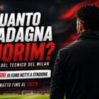 Quanto guadagna Amorim: grafica editoriale con il tecnico del Milan visto di spalle in uno stadio illuminato, bandiera astratta sfocata nei colori rosso, nero e bianco sullo sfondo e titolo dedicato allo stipendio dell'allenatore.