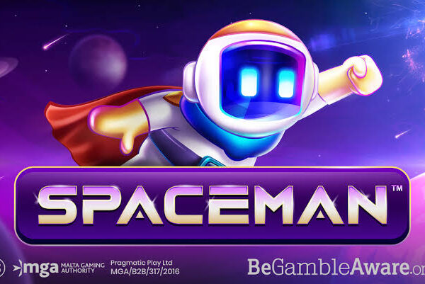 Personaggio astronauta stilizzato Spaceman su sfondo viola, con visiera luminosa blu, gesto della vittoria e logo SPACEMAN in primo piano.